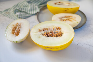 Canary and Snow Leopard Melon on Quartz Counter