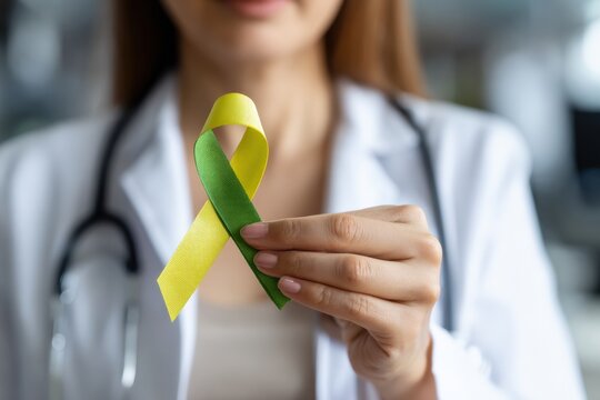 Doctor holding a green and yellow ribbon, showing support for people with disabilities and raising awareness about mental health issues like depression
