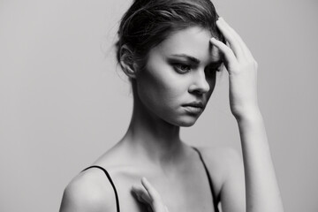 Pensive young woman with an expressive gaze, showcasing emotions of contemplation and introspection...