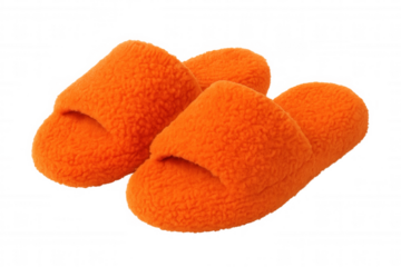 Plush orange slippers nestling around feet, providing warmth and comfort during peaceful home lounging moments
