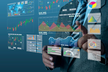 Businessman analyst manages the system database, and analysis data plans, and reports GDP marketing KPI sale. shows a dashboard chart. analytics business concept