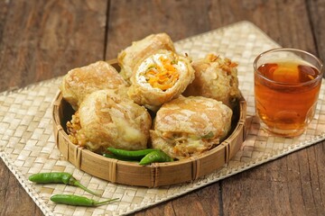 Tahu Isi. Stuffed tofu is known as fried food in the form of brown tofu filled with various fillings.