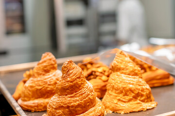 Delicious golden croissants displayed in a bakery setting