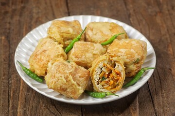 Tahu Isi. Stuffed tofu is known as fried food in the form of brown tofu filled with various fillings.
