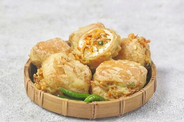 Tahu Isi. Stuffed tofu is known as fried food in the form of brown tofu filled with various fillings.