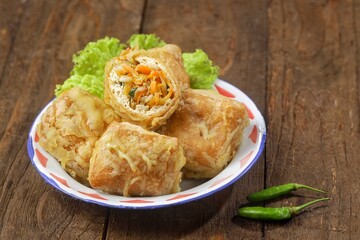 Tahu Isi. Stuffed tofu is known as fried food in the form of brown tofu filled with various fillings.