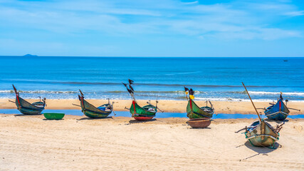 Boats with curved bows rest at Tam Thanh beach, Quang Nam, waiting to go to sea. This is a means of...