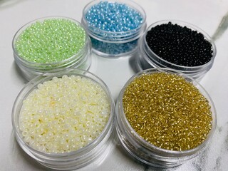 Assorted colorful seed beads set for jewelry making and DIY crafts.