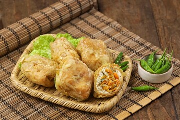 Tahu Isi. Stuffed tofu is known as fried food in the form of brown tofu filled with various fillings.
