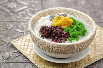 Dawet telasih, dawet solo or dawet Pasar Gede  or es Cendol which contains dawet, marrow porridge, black sticky rice porridge, jackfruit and telasih seeds