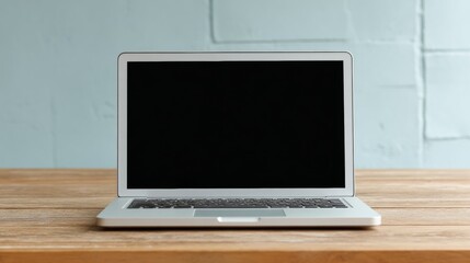 Fototapeta premium Laptop on wooden desk home office setup technology minimalistic straight-on view productivity