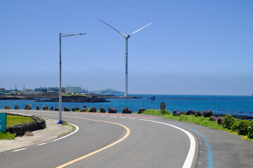 Fototapeta premium Curving Road to Offshore Turbine
