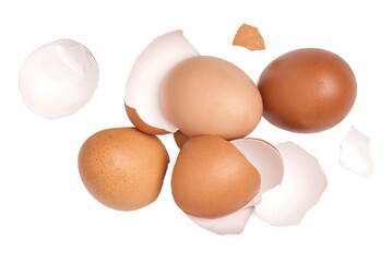 Top view broken eggshells stacked on white background.