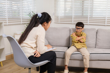 Obraz premium Child therapy counselor, psychologist session, mental health consultation, autistic boy communication with teddy toy, therapist comforts counseling for problem solving and healing support through play