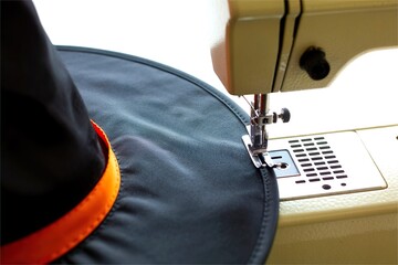 sewing machine sew witch hat. Make halloween costume in factory