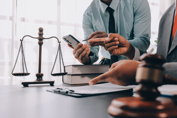 Lawyer explained to the client about the law that must be brought against the court case.
