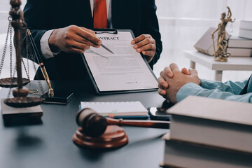 Lawyer explained to the client about the law that must be brought against the court case.
