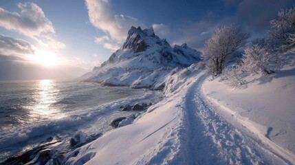 Snow-covered path winds along a coast, towards a majestic snow-capped mountain under a vibrant sunset sky