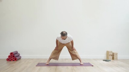 Man practicing meditation pose indoors with focused focus - Powered by Adobe