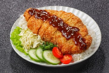 Chicken katsu or tori katsu is a Japanese dish consisting of seasoned chicken breast pieces, breaded and fried until crispy.
