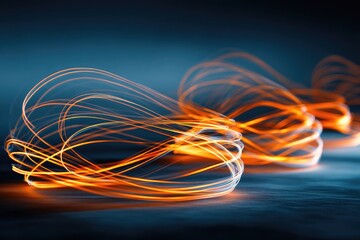 Abstract image of glowing orange light trails swirling on a dark background