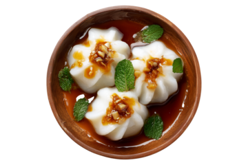 Steamed Faikakai dumplings topped with soy-based glaze, coconut syrup and sesame seeds served in wooden bowl isolated on white transparent background, concept of Polynesian cuisine