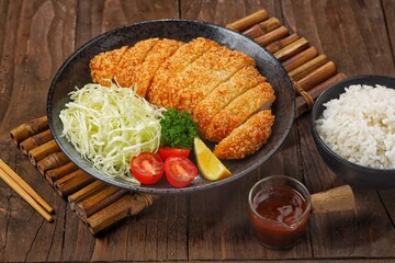 Crispy chicken katsu is a Japanese dish consisting of pieces of chicken (usually breast fillet) coated in breadcrumbs (panko) and fried