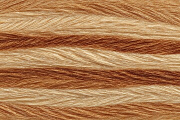 Close-up of textured yarn with horizontal stripes of tan and brown