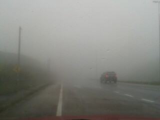 cars on road, raining and mist at Cameron Highland, Malaysia 