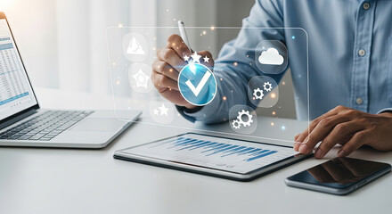 Middle Eastern man interacts with digital icons on a see through screen over a tablet