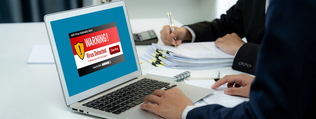 Virus warning alert on computer screen detected brisk cyber threat , hacker, computer virus and malware