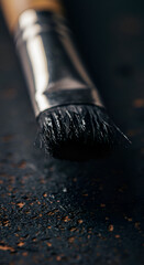 Photo of a Paint Brush with Black Bristles on a Textured Surface