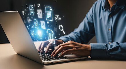 An asian person types on a laptop while digital documents float from the screen