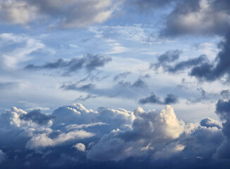 Blue Sky with White Fluffy Clouds. Natural Background for Weather, Nature, and Travel Concepts....