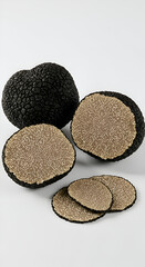 Photo of Black Truffles and Slices on White Background Gourmet Food