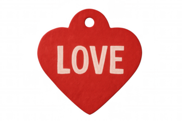 Heart-shaped red label featuring embroidered love text, floating against transparent backdrop