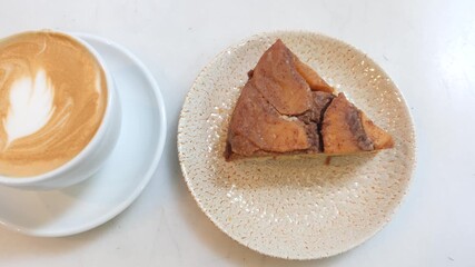 Delicious cake served with coffee at cozy cafe