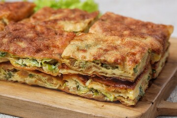 Martabak telor. Martabak is a dish commonly found in Saudi Arabia, Yemen, India, Bangladesh, Indonesia, Malaysia, Singapore, Southern Thailand and Brunei