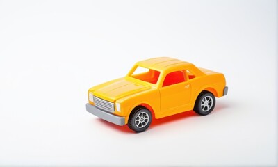 Fototapeta premium Yellow Plastic Toy Car on White Background