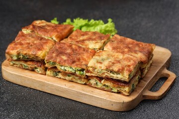 Martabak telor. Martabak is a dish commonly found in Saudi Arabia, Yemen, India, Bangladesh, Indonesia, Malaysia, Singapore, Southern Thailand and Brunei