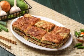 Martabak telor. Martabak is a dish commonly found in Saudi Arabia, Yemen, India, Bangladesh, Indonesia, Malaysia, Singapore, Southern Thailand and Brunei