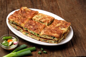 Martabak telor. Martabak is a dish commonly found in Saudi Arabia, Yemen, India, Bangladesh, Indonesia, Malaysia, Singapore, Southern Thailand and Brunei