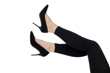 Women's legs in black high heels and leggings. Fatigue, arthritis and pain from wearing high heels. Fashionable style and elegant shoes for women audience.