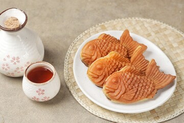 Bungeoppang Taiyaki is a popular Japanese fish-shaped cake filled with red bean jam, usually sold as a street food.