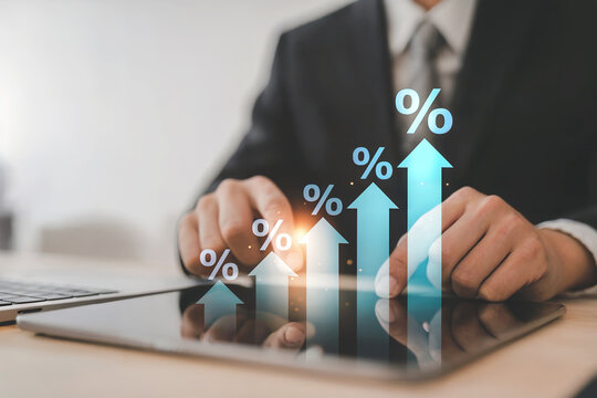 Business technology analyst using futuristic holographic interface to analyze financial growth charts and percentage increases with data visualization on a tablet - Powered by Adobe