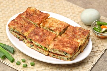 Martabak telor. Martabak is a dish commonly found in Saudi Arabia, Yemen, India, Bangladesh, Indonesia, Malaysia, Singapore, Southern Thailand and Brunei