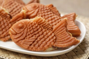 Bungeoppang Taiyaki is a popular Japanese fish-shaped cake filled with red bean jam, usually sold as a street food.