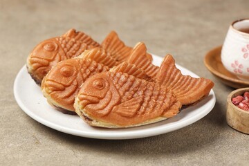 Bungeoppang Taiyaki is a popular Japanese fish-shaped cake filled with red bean jam, usually sold as a street food.