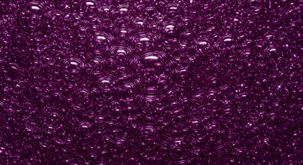 A deep purple textured pattern, featuring a repeating bubble effect, creates a unique and modern background for design, fashion, or advertising projects.