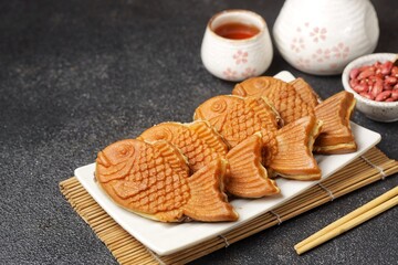 Bungeoppang Taiyaki is a popular Japanese fish-shaped cake filled with red bean jam, usually sold as a street food.